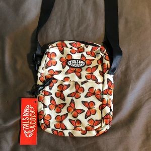 Small butterfly bag by the brand Petals and Peacocks and Dolls kill.